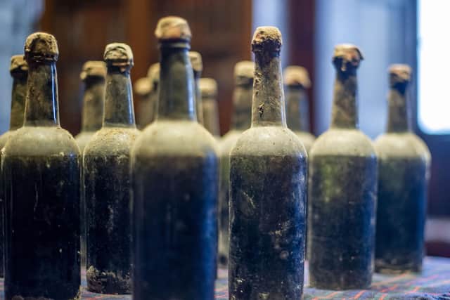 Bertie Troughton, resident trustee at Blair Castle in Perthshire, found 40 old bottles in an unassuming cellar room. They are now set to go up for auction. Picture: Lisa Ferguson