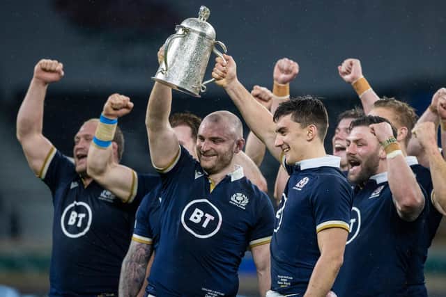 Cam Redpath, right, lifts the Calcutta Cup with fellow debutant Dave Cherry after Scotland's win over England at Twickenham last year. (Photo by Craig Williamson / SNS Group)
