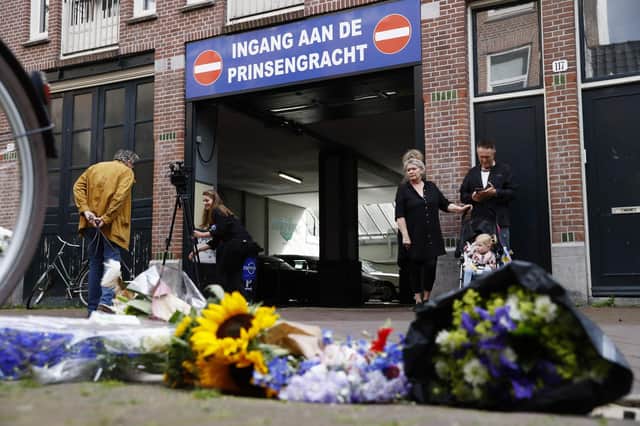 This picture taken in Amsterdam on July 7, 2021 shows flowers in  support of Peter de Vries.