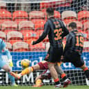 Dylan Levitt's deflected strike puts Dundee United ahead against Motherwell.