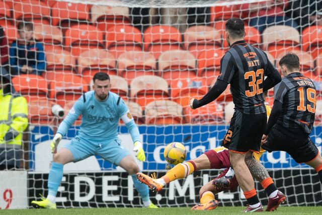 Dylan Levitt's deflected strike puts Dundee United ahead against Motherwell.