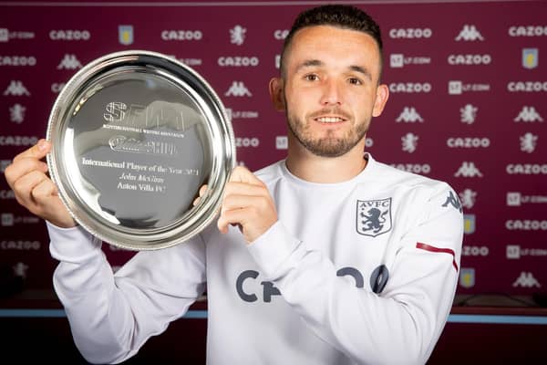Aston Villa midfielder John McGinn with the Scottish Football Writers International Player of the Year award.