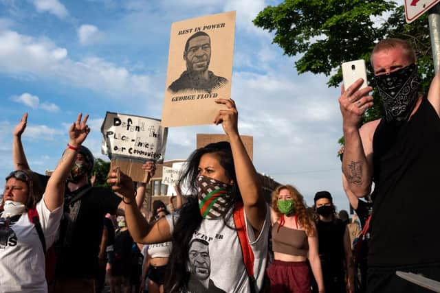 Protesters confront police outside the 3rd Police Precinct in Minneapolis, Minnesota (Photo: Stephen Maturen/Getty Images)