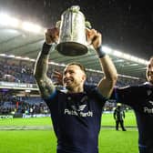 Stuart Hogg and Finn Russell with the Calcutta Cup following victory over England in 2022.
