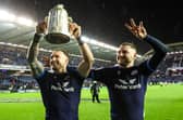 Stuart Hogg and Finn Russell with the Calcutta Cup following victory over England in 2022.