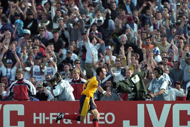 Craig Burley celebrates in front of the Scotland fans after scoring Scotland's last goal at a World Cup, in the draw with Norway at France 98 - the country's most recent appearance at the global event that Callum McGregor admits he  doesn't remember through only having just turned six at the time. (Photo by SNS Group).