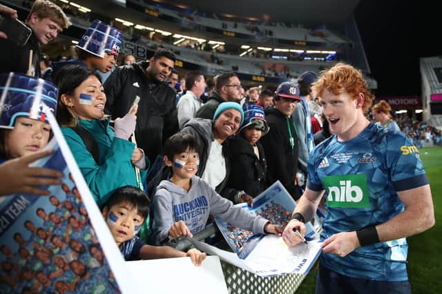 Scottish-born scrum-half Finlay Christie celebrates with the crowd after the Blues' victory over the Highlanders in the Super Rugby Trans-Tasman Final at Eden Park on Saturday. Picture: Fiona Goodall/Getty Images