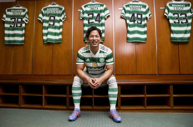 New Celtic signing Tomoki Iwata is unveiled at a press conference.