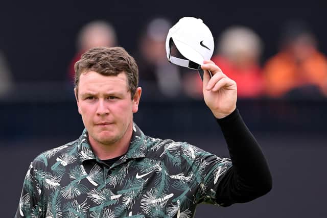 Bob MacIntyre  acknowledges the crowd on the 18th at the end of his third round in the 152nd Open at Royal Troon. Picture: Ross Kinnaird/Getty Images.