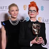 US-Australian actress Cate Blanchett poses with Fellowship Award winning costume designer Sandy Powell with her award in the winner's room at the BAFTA British Academy Film Awards.