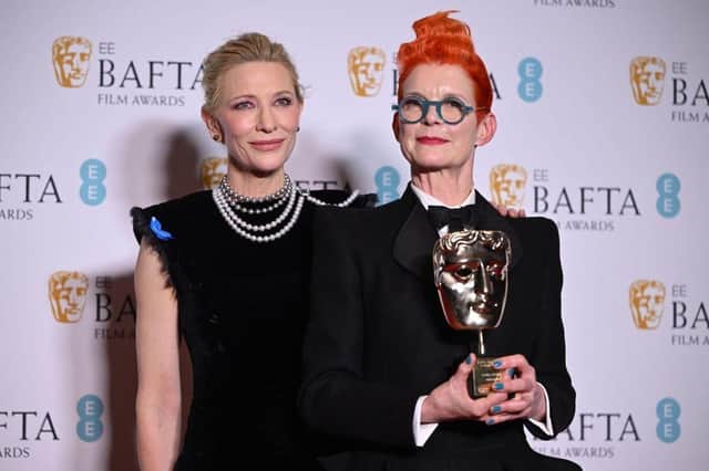 US-Australian actress Cate Blanchett poses with Fellowship Award winning costume designer Sandy Powell with her award in the winner's room at the BAFTA British Academy Film Awards.