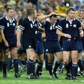 Scottish players look dejected after their loss to Australia in the quarter-final of the 2003 Rugby World Cup. Pic: CHRISTOPHE SIMON/AFP via Getty Images