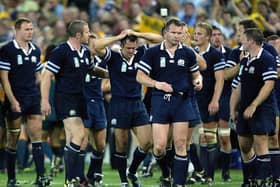 Scottish players look dejected after their loss to Australia in the quarter-final of the 2003 Rugby World Cup. Pic: CHRISTOPHE SIMON/AFP via Getty Images