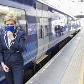First Minister Nicola Sturgeon unveils a specially branded train to mark the Scottish Government's takeover of ScotRail on April 1 (Picture: Robert Perry/PA Wire)