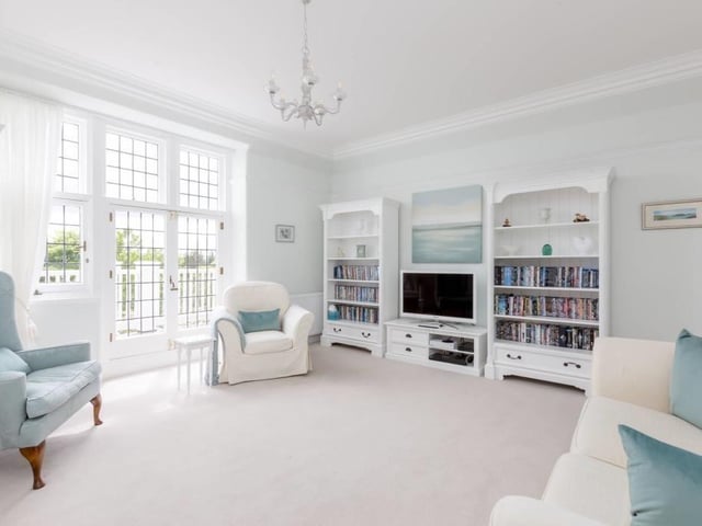 Family room with double doors to balcony.