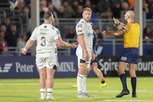 Dragons' Lloyd Fairbrother (No. 3) is shown the yellow card by referee Andrea Piardi during the defeat by Edinburgh. (Photo by Simon Wootton / SNS Group)