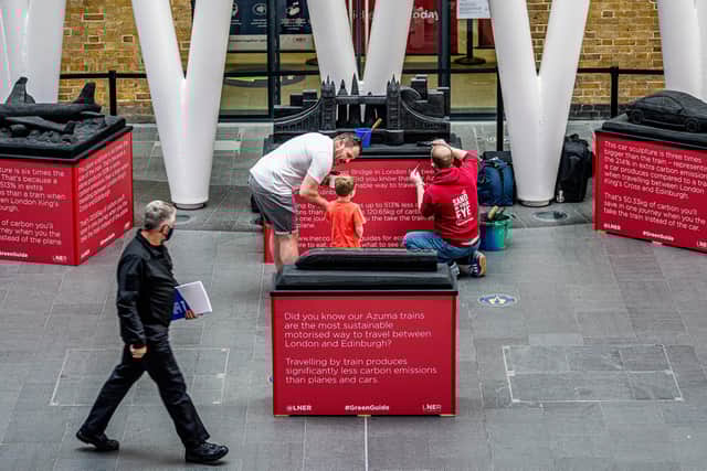 The size and weight of the sculptures reflect the relative carbon emissions of aeroplanes, trains and cars. Picture: Charlotte Graham