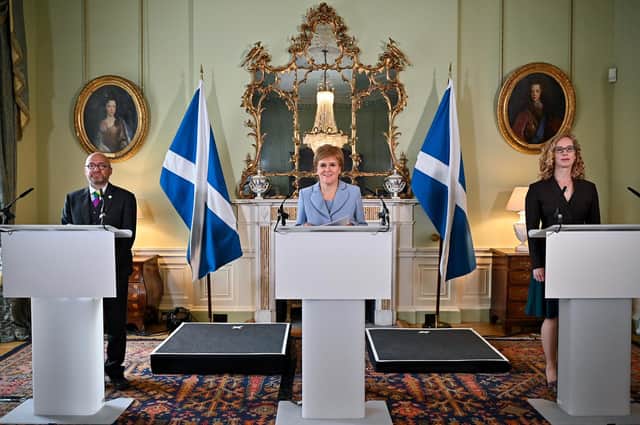 'Vote SNP, get the Greens' seems to be the message from First Minister Nicola Sturgeon, flanked by Scottish Greens co-leaders Patrick Harvie and Lorna Slater yesterday (Photo by Jeff J Mitchell - Pool / Getty Images)