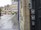 Key boxes for Airbnb properties outside a tenement flat in Upper Bow, Edinburgh