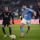 Malmo's Croatian forward Antonio-Mirko Colak (C) challenges Juventus' Brazilian midfielder Arthur (L) and Juventus' Italian defender Daniele Rugani during the UEFA Champions League match on December 8, 2021. (Photo by MARCO BERTORELLO/AFP via Getty Images)