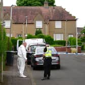 The scene in Fernieside Crescent, Edinburgh, following the death of a 78-year-old woman. Photo: Jane Barlow/PA Wire