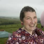 Elaine Miller, a comedian and physiotherapist pictured with a 19ft inflatable model of a vagina, is being investigated for revealing her merkin in the Scottish Parliament (Picture: Sandy Young/PA)