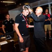 Former Scotland team doctor Donald Macleod presents Finn Russell with his first cap following his debut against the United States in Houston in 2014. Picture: Craig Watson/SNS