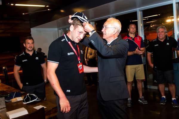 Former Scotland team doctor Donald Macleod presents Finn Russell with his first cap following his debut against the United States in Houston in 2014. Picture: Craig Watson/SNS