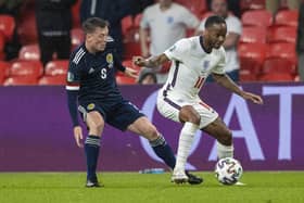 Scotland's Callum McGregor (left) tackles England's Raheem Sterling in the last encounter between the great rivals. The Celtic captain asserting that going one better than that scoreless draw at Wembley in June 2021 would trump a draw between Norway and Georgia that would secure Steve Clarke men's place in summer's Euro finals. (Photo by Alan Harvey / SNS Group)