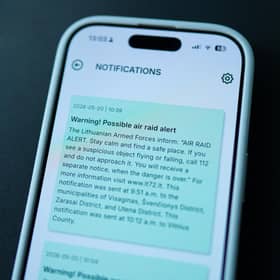 This photograph shows a mobile phone that displays a warning of a possible air raid, in Vilnius on May 20, 2026.