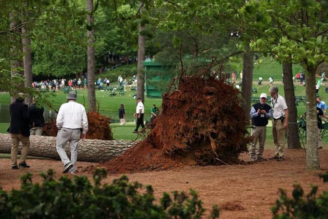 Course officials look over fallen trees on the 17th hole during the second round of the 2023 Masters Tournament at Augusta National Golf Club. Picture: Patrick Smith/Getty Images.