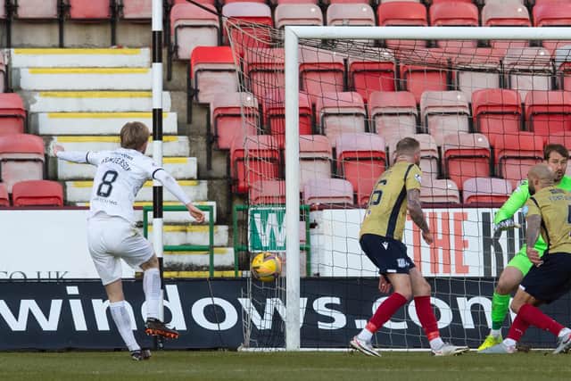 Liam Fontaine blocks a shot from Dunfermline's Ewan Henderson.