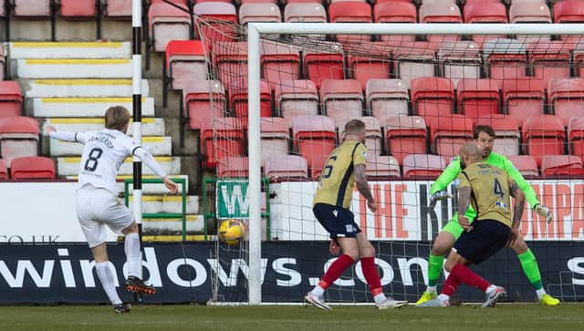 Liam Fontaine blocks a shot from Dunfermline's Ewan Henderson.