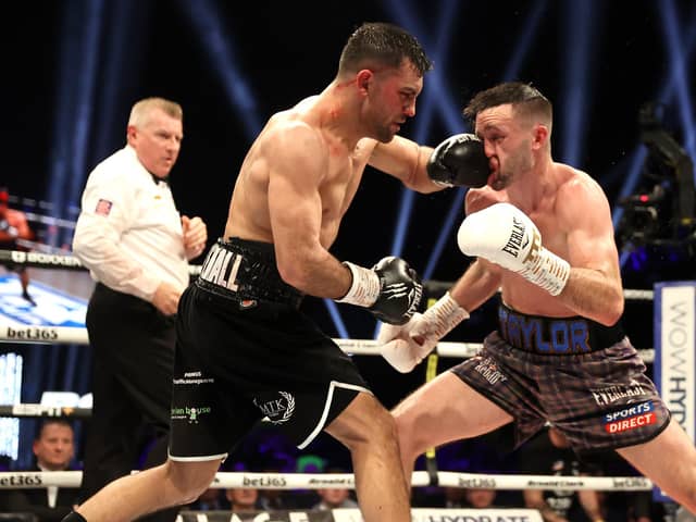 Jack Catterall (left) in action against Josh Taylor in the junior welterweight bout at the OVO Hydro, Glasgow. Picture date: Saturday February 26, 2022.