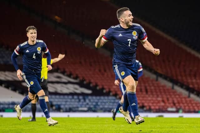 John McGinn wheels away after netting the equaliser