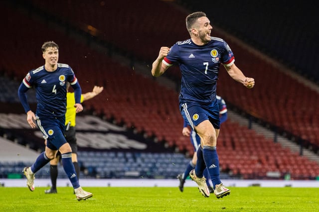 John McGinn wheels away after netting the equaliser