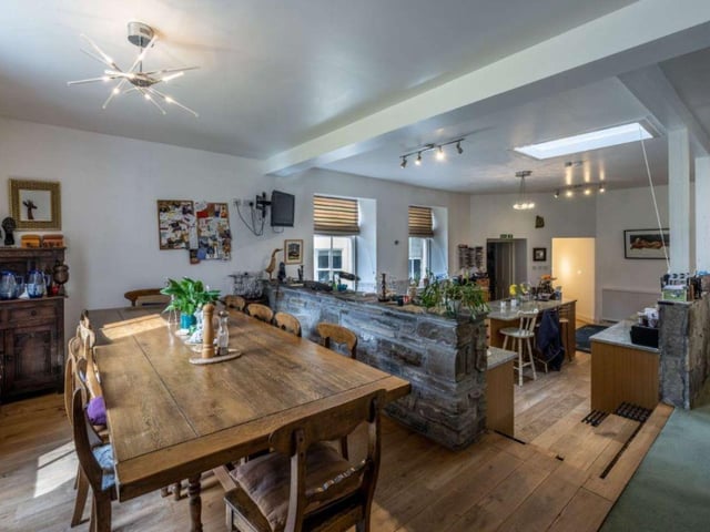 The split level dining kitchen is the warm heart of the home, with access to a prepping kitchen, boot/utility room and home office.