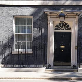 The famous black door of 10 Downing Street, London.