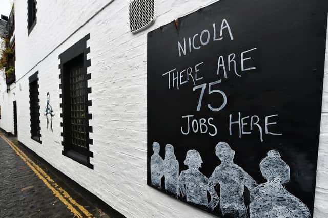 A sign outside the Ubiquitous Chip in Glasgow addresses Nicola Sturgeon directly as it warns about the consequences of the latest pub and restaurant shutdown (Picture: John Devlin)