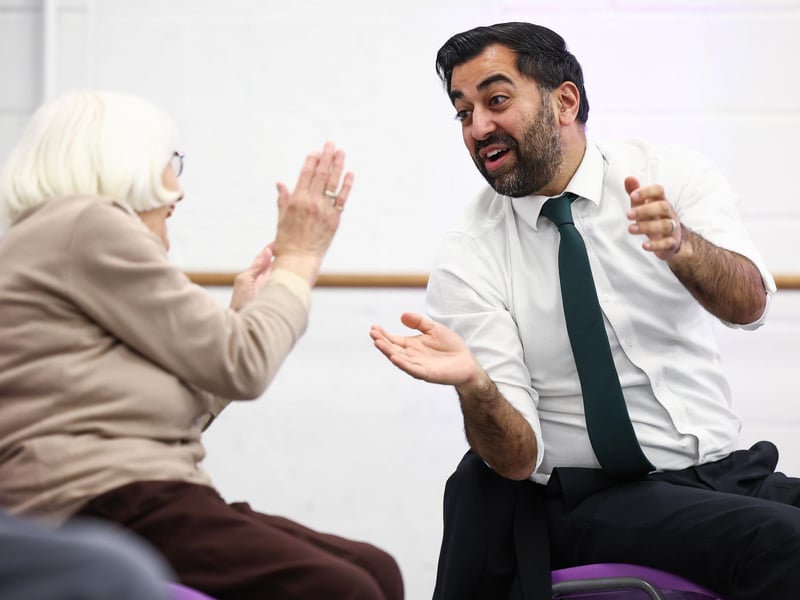 Humza Yousaf takes part in a dance performance during a visit to the Edinburgh Community Performing Arts re-connect project