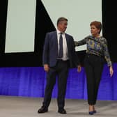 SNP deputy leader and Cabinet Secretary for Justice and Veterans Keith Brown with First Minister Nicola Sturgeon on stage