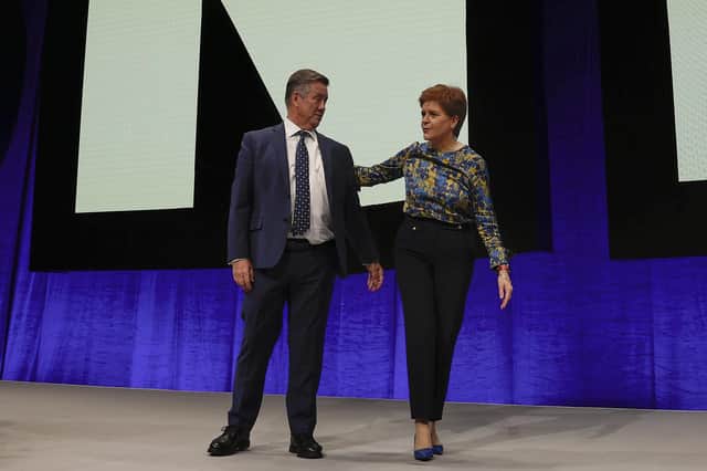 SNP deputy leader and Cabinet Secretary for Justice and Veterans Keith Brown with First Minister Nicola Sturgeon on stage