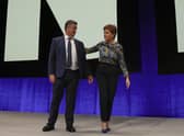 SNP deputy leader and Cabinet Secretary for Justice and Veterans Keith Brown with First Minister Nicola Sturgeon on stage