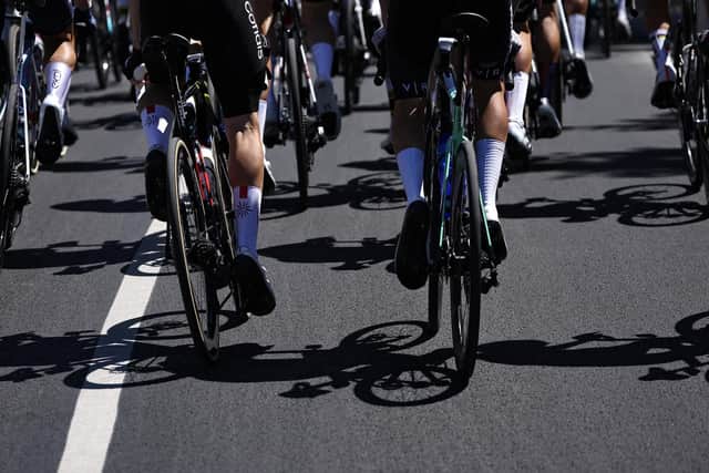 Riders' cycles cast shadows on the road as they tackled yesterday's 16th stage of this year's Tour de France, 171.5km between Montpellier and Mont Ventoux in southern France (Picture: Anne-Christine Poujoulat/AFP via Getty)