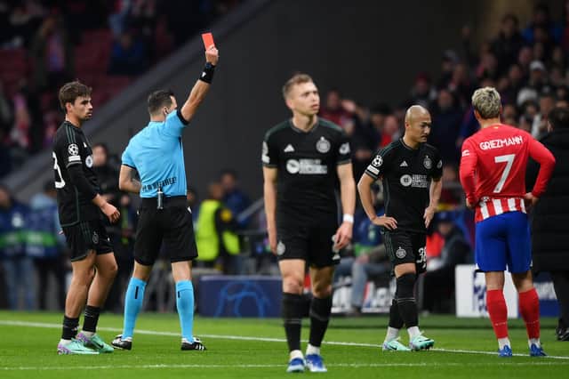 Referee Ivan Kruzliak shows a red card to Celtic's Daizen Maeda during the first-half of the defeat to Atletico Madrid. (Photo by Justin Setterfield/Getty Images)