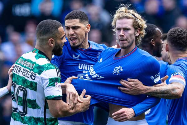 Celtic's Cameron Carter-Vickers grabs Rangers' Todd Cantwell by the shirt at full time.