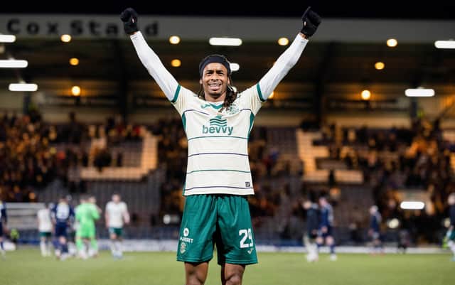 Jair Tavares celebrates in front of the Hibs fans after a big win in Dundee.