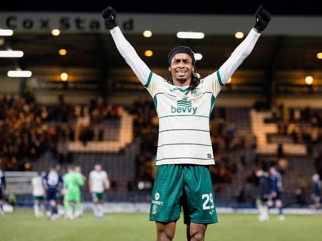 Jair Tavares celebrates in front of the Hibs fans after a big win in Dundee.