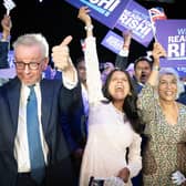 Michael Gove (left), Rishi Sunak's wife Akshata Murthy (centre) and mother Usha Sunak (right) cheer former chancellor Rishi Sunak during a hustings event at Wembley Arena in London. Picture: Stefan Rousseau/PA Wire