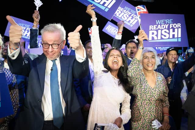 Michael Gove (left), Rishi Sunak's wife Akshata Murthy (centre) and mother Usha Sunak (right) cheer former chancellor Rishi Sunak during a hustings event at Wembley Arena in London. Picture: Stefan Rousseau/PA Wire
